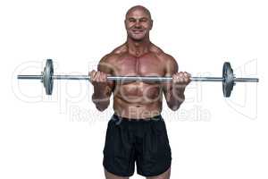 Portrait of smiling muscular man lifting crossfit