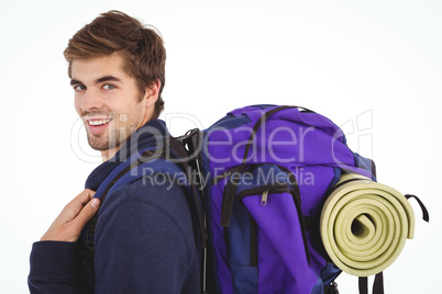 Side view of happy man with backpack