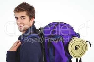 Side view of happy man with backpack