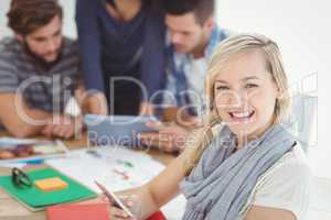 Portrait of cheerful woman using smartphone