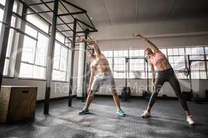 Two fit people doing fitness