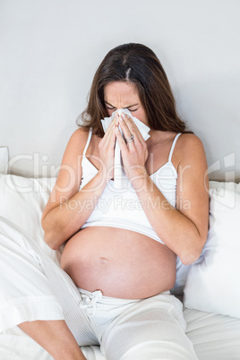 Woman blowing nose in tissue