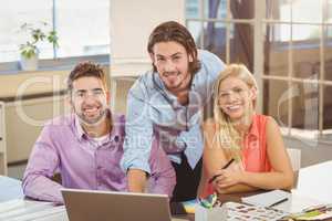 Confident business people working in office
