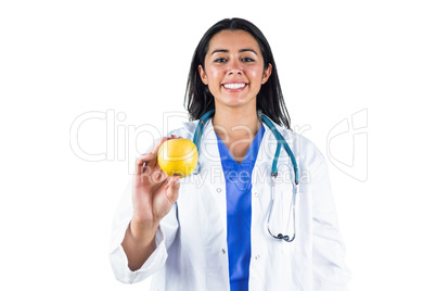 Smiling doctor with an apple in her hand