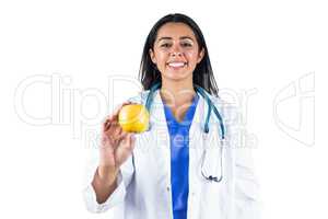 Smiling doctor with an apple in her hand
