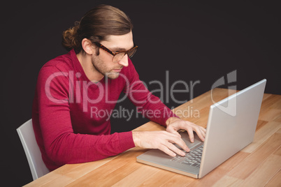 Creative businessman working on laptop