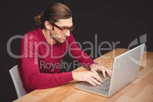 Creative businessman working on laptop