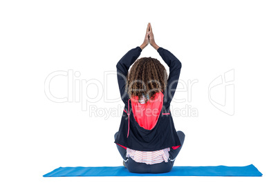 Rear view of woman practicing yoga