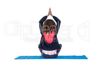 Rear view of woman practicing yoga