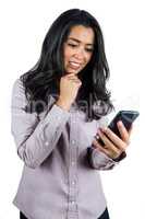 Smiling businesswoman using her smartphone