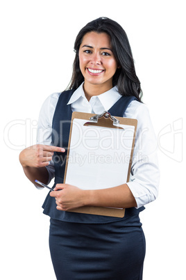 Smiling woman holding a clipboard