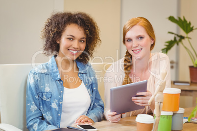 Businesswomen using digital tablet