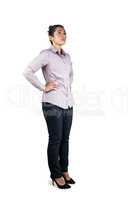 Businesswoman looking upwards with hands on hips
