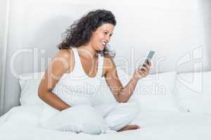 Happy beautiful woman using mobile phone