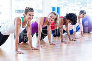 Women exercising on floor
