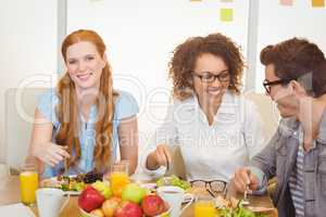 Businesswoman having lunch with colleagues