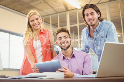 Portrait business people looking at digital table