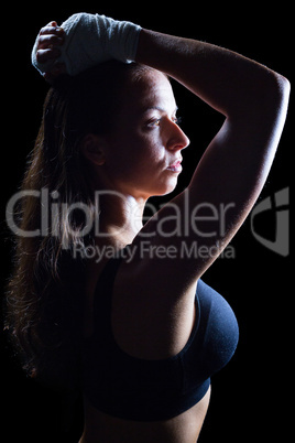 Side view of thoughtful athlete with hands on head