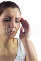 Woman with eyes closed and suffering from headache