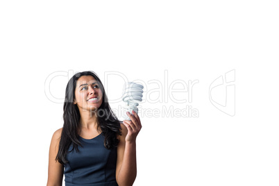 Woman holding a light bulb in her hand