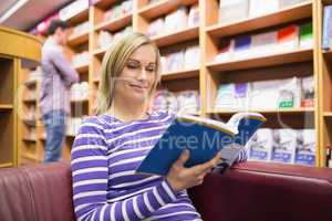 Young woman reading book