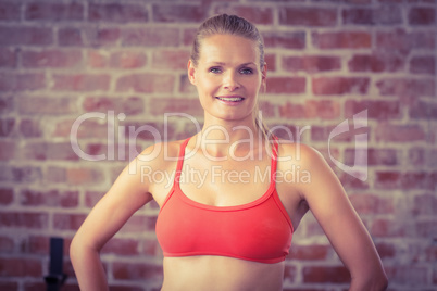 Portrait of smiling fit woman looking at camera