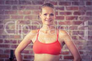 Portrait of smiling fit woman looking at camera