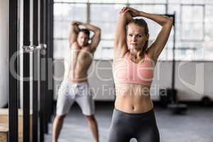 Two fit people doing fitness