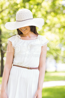 Happy young woman in sun hat