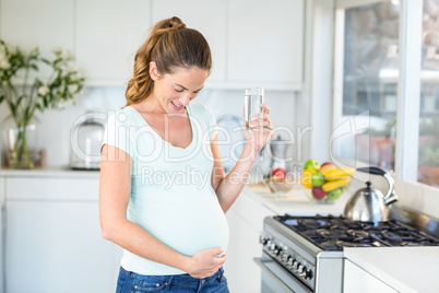 Happy woman holding water