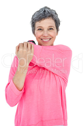 Portrait of happy mature woman stretching