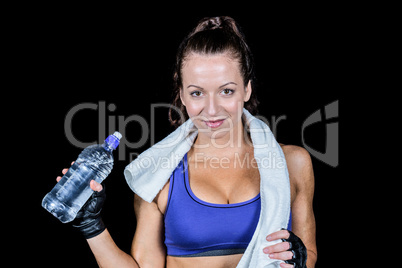 Portrait of pretty smiling woman with water bottle