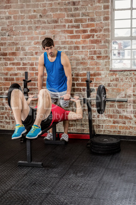 Men exercising with barbell