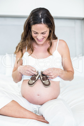 Happy woman with boots on belly