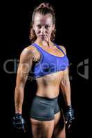 Portrait of sporty woman with gloves