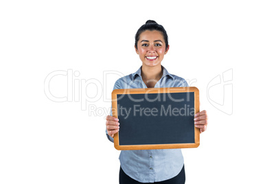 Smiling woman holding a small chalkboard