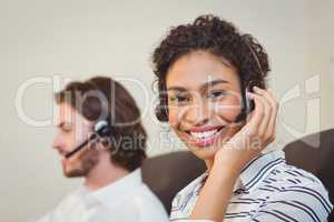 Portrait of smiling businesswoman in call center