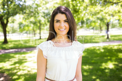 Portrait of happy woman in white dress