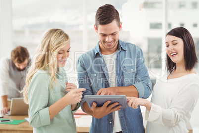 Happy Business professionals using digital tablet Happy Business professionals using digital tablet