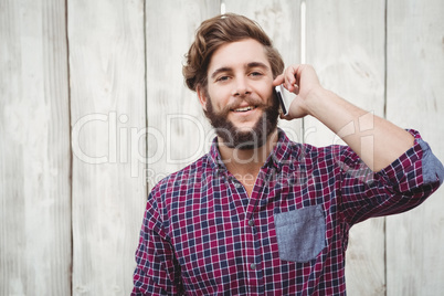 Portrait of hipster using mobile phone