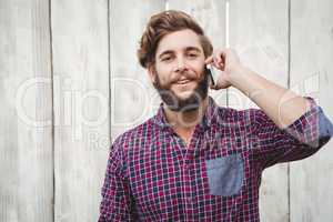 Portrait of hipster using mobile phone