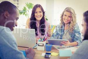 Portrait of smiling female business people using digital tablet