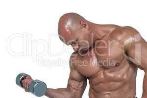 Shirtless athlete lifting dumbbells