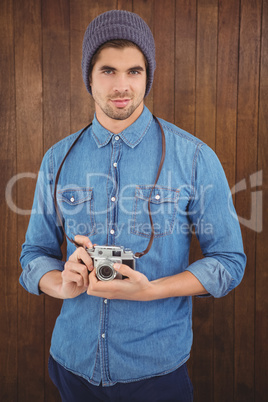 Portrait of confident  hipster using camera