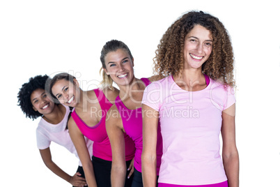 Portrait of smiling women standing in row