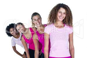 Portrait of smiling women standing in row