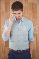 Businessman talking on mobile phone standing in office