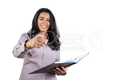 Businesswoman holding a business ledger