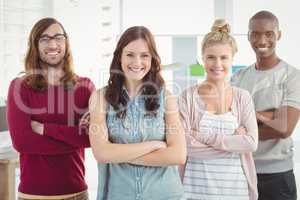 Portrait of smiling business team with arms crossed
