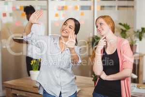 Happy businesswomen discussing in office